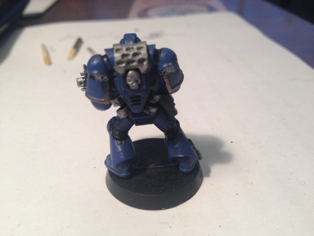 I'm new to mini-painting and I did the free Space Marine from the Warhammer  store. I had to change his pose some because his hands wouldn't hold the  gun. Can y'all give